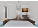 Spacious hallway with hardwood floors, crown molding, and a wall-mounted TV at 116 Anderson Farm Ct, Mooresville, NC 28117