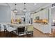 Open concept kitchen with stainless steel appliances, granite counters, and a center island with bar seating at 116 Anderson Farm Ct, Mooresville, NC 28117