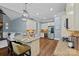 Bright kitchen featuring custom cabinets, stainless steel appliances, granite countertops, and modern pendant lighting at 116 Anderson Farm Ct, Mooresville, NC 28117