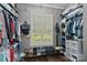 Organized walk-in closet with shelves, rods, and shoe racks at 116 Anderson Farm Ct, Mooresville, NC 28117