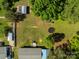 Aerial view highlighting the spacious backyard, featuring multiple outbuildings, a trampoline, and a playset at 1238 Moss Springs Rd, Albemarle, NC 28001