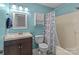 Bathroom featuring modern sink, toilet, cabinet, mirror and shower-tub combo at 1238 Moss Springs Rd, Albemarle, NC 28001