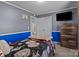 A cozy bedroom with a baseball themed bed, flat screen TV, and attached bathroom at 1238 Moss Springs Rd, Albemarle, NC 28001