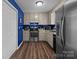 Bright kitchen featuring stainless steel appliances and view of the laundry room at 1238 Moss Springs Rd, Albemarle, NC 28001