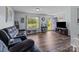 Comfortable living room with hardwood floors, modern decor, and plenty of natural light at 1238 Moss Springs Rd, Albemarle, NC 28001