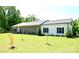 Charming single-story home with a well-manicured lawn and inviting front porch at 129 Devon Dr, Heath Springs, SC 29058