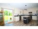 Modern kitchen features stainless steel appliances and functional center island at 129 Devon Dr, Heath Springs, SC 29058