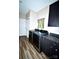 Laundry room featuring new appliances, hardwood style floors, and a window at 129 Devon Dr, Heath Springs, SC 29058