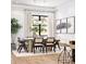 Elegant dining room featuring natural light, modern lighting fixtures, and comfortable seating for memorable gatherings at 181 Asbury Cir, Mooresville, NC 28117