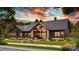 Stunning modern farmhouse-style home with beautiful landscaping and a covered porch at 181 Asbury Cir, Mooresville, NC 28117