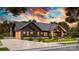 Beautiful modern farmhouse-style home with a dark exterior, covered porch, and lush landscaping at 181 Asbury Cir, Mooresville, NC 28117