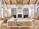 Inviting living room with wooden beams, fireplace, comfortable seating, and stylish decor for a welcoming ambiance at 181 Asbury Cir, Mooresville, NC 28117