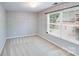 Bright empty bedroom with neutral carpet and large window offering abundant natural light at 13817 Kings Carriage Ln, Charlotte, NC 28278