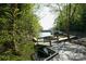 A private dock with boat slip provides peaceful waterfront access and scenic views on a sunny day at 13817 Kings Carriage Ln, Charlotte, NC 28278