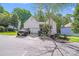 Charming home with an attached garage and beautifully landscaped front yard at 13817 Kings Carriage Ln, Charlotte, NC 28278
