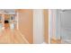 Hallway featuring hardwood floors and neutral paint leading to the living areas and bedrooms at 13817 Kings Carriage Ln, Charlotte, NC 28278