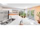 Well-lit kitchen features stainless steel appliances, white cabinetry, and views of the backyard at 13817 Kings Carriage Ln, Charlotte, NC 28278