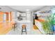 The kitchen includes an island with bar seating and lots of sunlight at 13817 Kings Carriage Ln, Charlotte, NC 28278