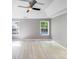 Large main bedroom with hardwood floors, tray ceiling and two windows at 13817 Kings Carriage Ln, Charlotte, NC 28278