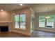 Bright living room with windows and glass doors that offer a lovely outdoor view at 142 Prestwick Way # 18, Mooresville, NC 28115