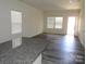 Open living area with wood-look flooring and bright, natural light at 148 Kodak Dr, Statesville, NC 28625