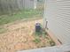 Property backyard featuring air conditioner unit and undeveloped land at 149 Kodak Dr, Statesville, NC 28625