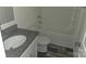 A stylish bathroom featuring a granite countertop vanity, and shower/tub combo at 149 Kodak Dr, Statesville, NC 28625