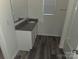 This bathroom features a modern vanity with gray granite countertops and a shower/tub combo at 149 Kodak Dr, Statesville, NC 28625