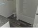 This bathroom features a modern vanity with gray granite countertops and a shower/tub combo at 149 Kodak Dr, Statesville, NC 28625