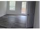Sunlit bedroom with luxury vinyl plank flooring, French doors, and natural light at 149 Kodak Dr, Statesville, NC 28625