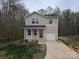 Attractive two-story home boasting a covered front porch and a one-car garage at 149 Kodak Dr, Statesville, NC 28625