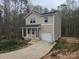 Attractive two-story home boasting a covered front porch and a one-car garage at 149 Kodak Dr, Statesville, NC 28625