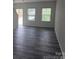 Bright living room featuring luxury vinyl plank flooring and natural light through windows at 149 Kodak Dr, Statesville, NC 28625
