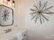 Bathroom with a modern sink, a stylish mirror, and unique wall decor creating a visually appealing space at 1501 Briarfield Dr, Charlotte, NC 28205