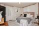 Serene bedroom with natural light, neutral decor, stylish bedding, and two windows with natural light at 1501 Briarfield Dr, Charlotte, NC 28205