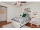 Inviting bedroom with a dinosaur-themed bed, decorative lamps, and a window offering natural light and an open doorway at 1501 Briarfield Dr, Charlotte, NC 28205