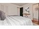 This bedroom has a stylish bed, modern decor, and a doorway to the bathroom, all contribute to the room's appeal at 1501 Briarfield Dr, Charlotte, NC 28205