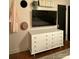 Bright bedroom featuring a white dresser and TV, complemented by stylish decor at 1501 Briarfield Dr, Charlotte, NC 28205