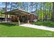 Brick home with covered carport and well-maintained yard at 1501 Briarfield Dr, Charlotte, NC 28205