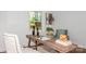 Bright home office featuring a rustic desk, comfortable chairs, and natural light creating a welcoming workspace at 1501 Briarfield Dr, Charlotte, NC 28205