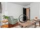 Cozy home office featuring a rustic desk, green chair, and stylish decor creating a comfortable work environment at 1501 Briarfield Dr, Charlotte, NC 28205