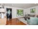 Inviting living room with hardwood floors, ample natural light, large windows, and a comfortable seating area at 1501 Briarfield Dr, Charlotte, NC 28205