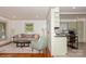 Bright living space with hardwood floors seamlessly connecting to kitchen and offering ample natural light at 1501 Briarfield Dr, Charlotte, NC 28205