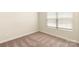 Bedroom with plush carpet and a window with white blinds at 1550 Doran Ter, Richburg, SC 29729