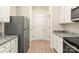 Modern kitchen featuring stainless steel refrigerator, granite countertops, and lots of storage space at 1550 Doran Ter, Richburg, SC 29729