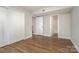 Spacious bedroom featuring vinyl floors, two closets, and attached bathroom at 1600 Sharon W Rd # 8, Charlotte, NC 28210