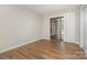 Bright bedroom with wood floors, patio door and white blinds to let plenty of light in at 1600 Sharon W Rd # 8, Charlotte, NC 28210