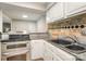 Kitchen features stainless steel appliances, granite countertops, and stylish backsplash at 1600 Sharon W Rd # 8, Charlotte, NC 28210