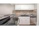 Kitchen features stainless steel appliances, granite countertops, and stylish backsplash at 1600 Sharon W Rd # 8, Charlotte, NC 28210