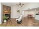 Bright living room features a stone fireplace, high ceilings, and modern decor at 1600 Sharon W Rd # 8, Charlotte, NC 28210